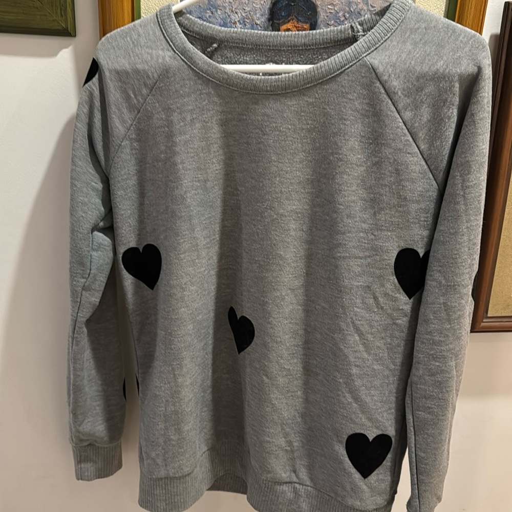Is a nice sweater grey with a soft black heart